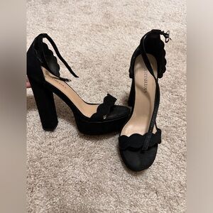Woman’s Black Heel